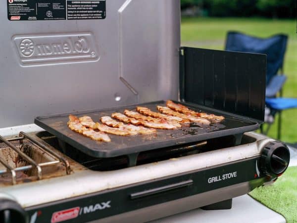 a grill that has some meat on it